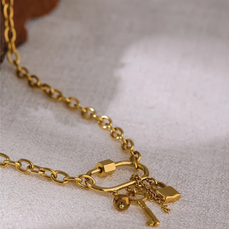Edgy Rhinestone Key, Tassel, and Lock Pendant Necklace