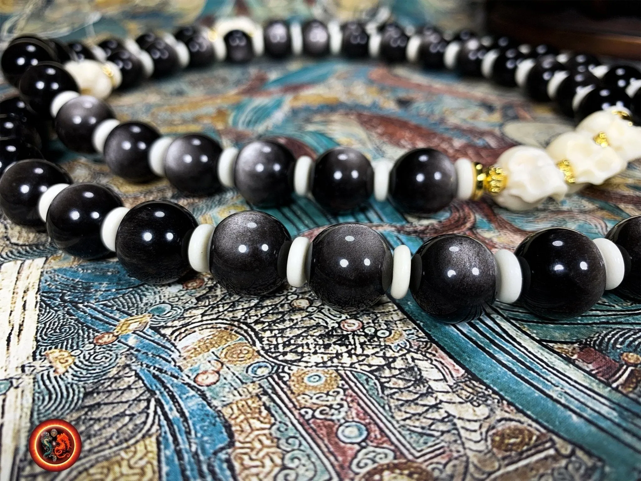 Mala artisanal- 54 perles d'obsidiennes argentées.